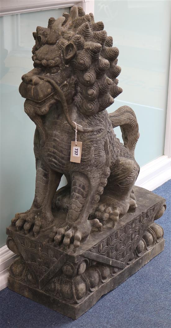 A pair of modern dark reconstituted stone Chinese seated kylin, approx. H.102cm